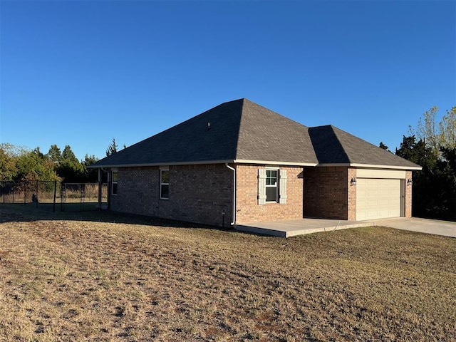 view of home's exterior with a garage