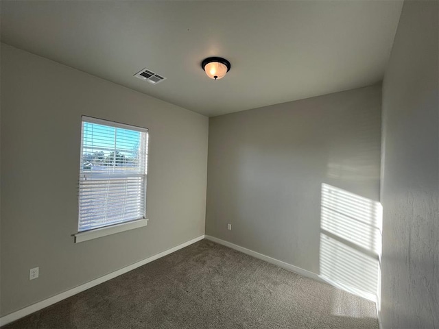 unfurnished room featuring carpet flooring