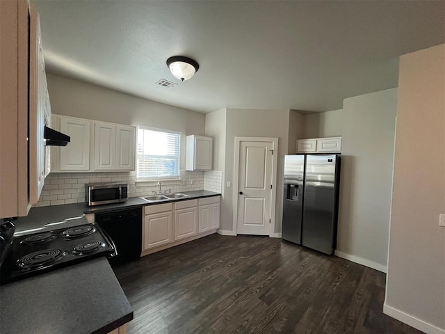 kitchen featuring white cabinetry, sink, tasteful backsplash, dark hardwood / wood-style floors, and black appliances