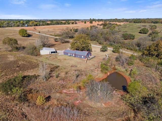 drone / aerial view with a water view and a rural view