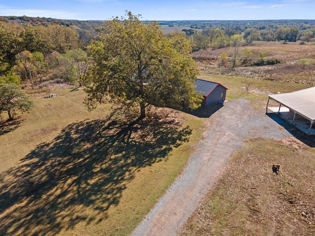 birds eye view of property with a rural view