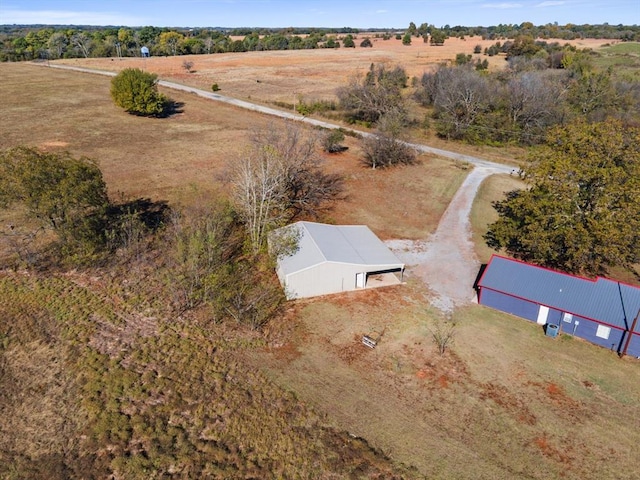 birds eye view of property with a rural view