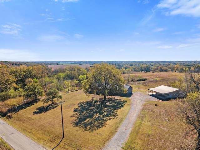 birds eye view of property with a rural view