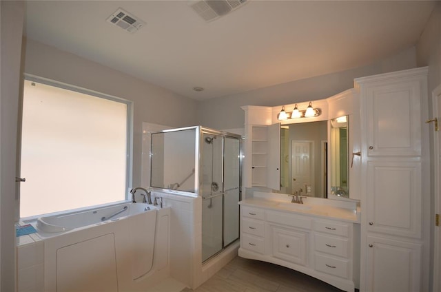 bathroom featuring vanity and plus walk in shower