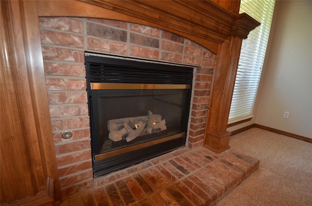 room details with a fireplace and carpet