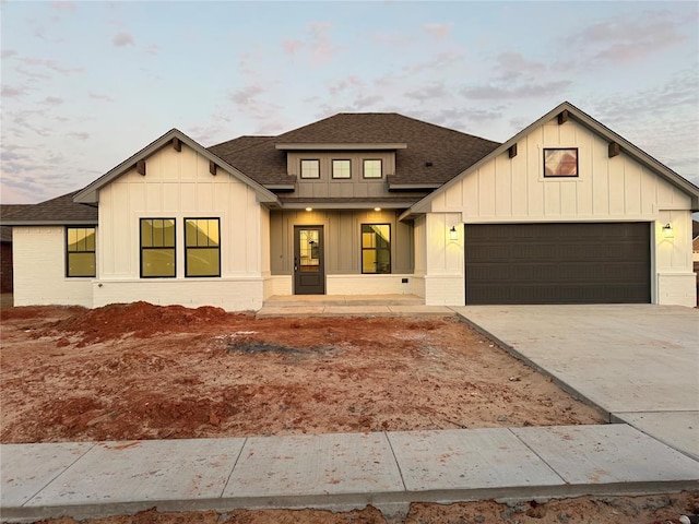 modern farmhouse style home featuring a garage