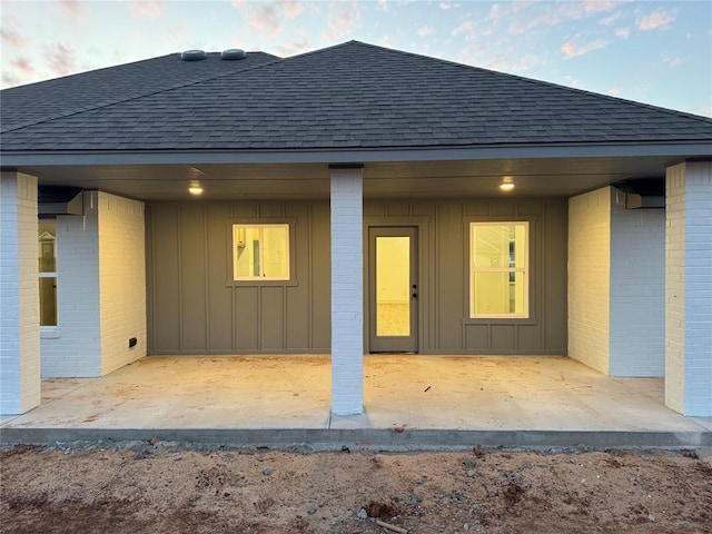 back of property featuring a patio