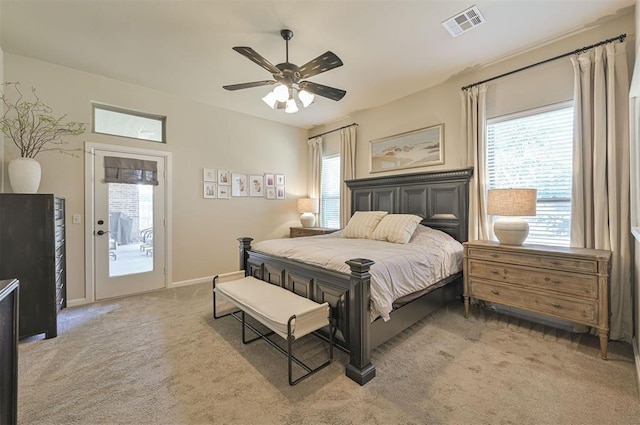 bedroom with a ceiling fan, baseboards, visible vents, light carpet, and access to outside