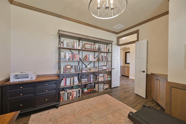 interior space featuring visible vents, dark wood finished floors, an inviting chandelier, arched walkways, and ornamental molding