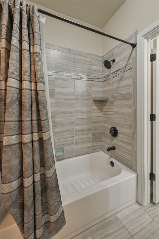 full bathroom with shower / bath combination with curtain