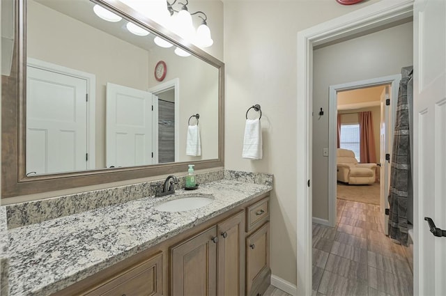 bathroom with vanity and baseboards