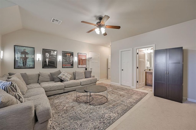 living room with visible vents, baseboards, ceiling fan, light colored carpet, and lofted ceiling