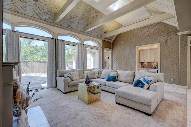 living room with lofted ceiling with skylight