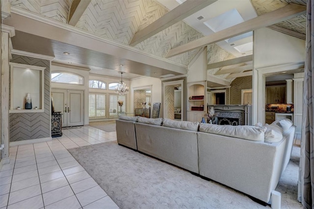 living room featuring a chandelier, light tile patterned floors, and high vaulted ceiling