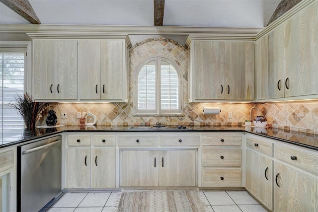 kitchen featuring dishwasher, beam ceiling, light tile patterned flooring, and dark stone counters