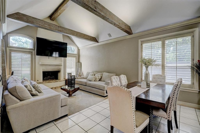 living room with vaulted ceiling with beams and light tile patterned flooring