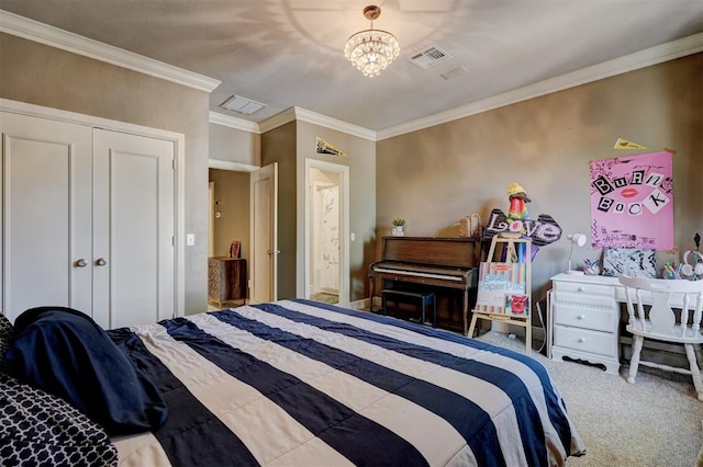 carpeted bedroom with a closet, crown molding, and a notable chandelier