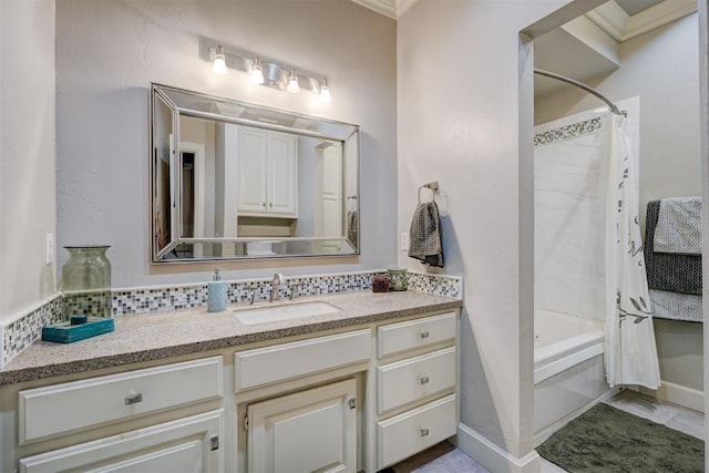 bathroom featuring vanity, shower / bathtub combination with curtain, and crown molding