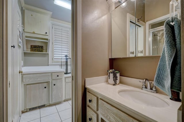 bathroom with vanity and tile patterned floors