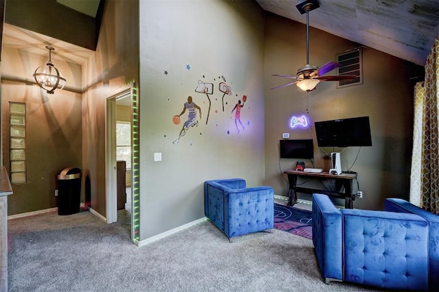 recreation room with carpet flooring, ceiling fan with notable chandelier, and high vaulted ceiling