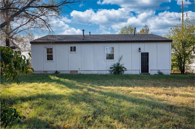 rear view of house with a lawn