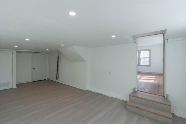 bonus room featuring light hardwood / wood-style floors