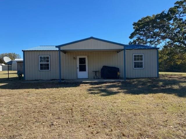 view of outbuilding featuring a yard