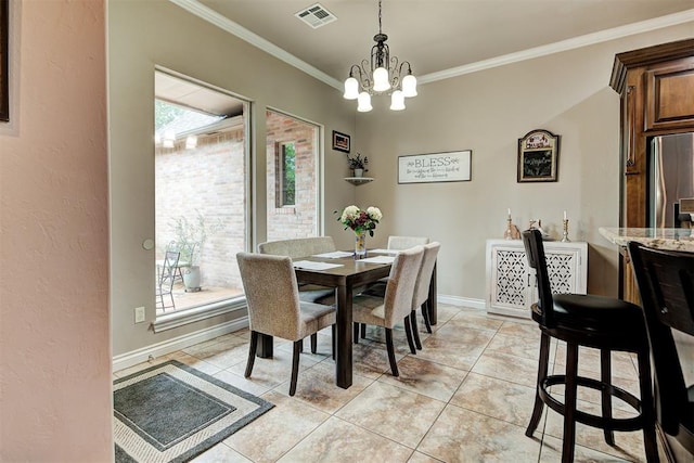 dining room with light tile patterned floors, visible vents, plenty of natural light, and ornamental molding