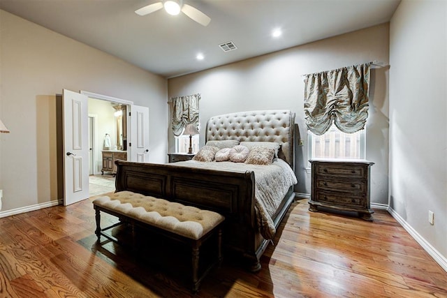 bedroom featuring connected bathroom, ceiling fan, and light hardwood / wood-style flooring