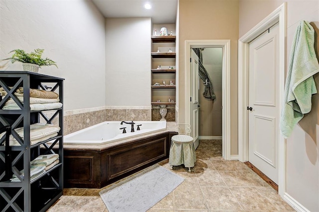 bathroom featuring tile patterned floors and a bathing tub