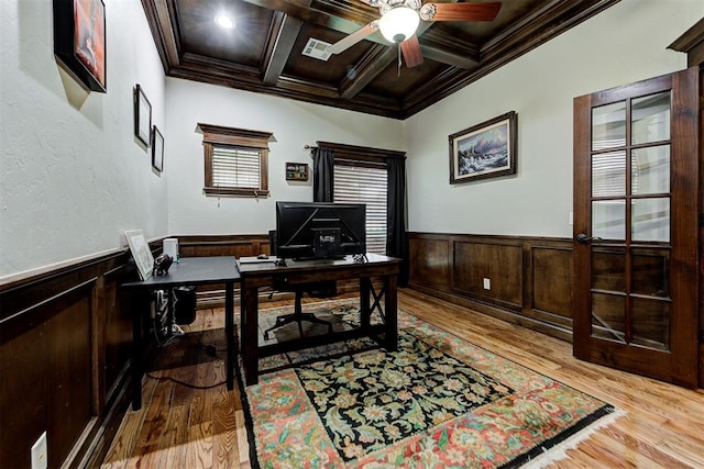 office area with crown molding, beamed ceiling, light wood-style flooring, wainscoting, and coffered ceiling