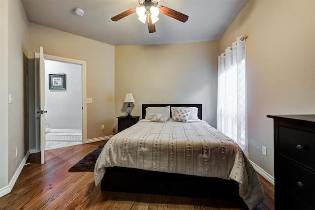 bedroom featuring hardwood / wood-style floors and ceiling fan