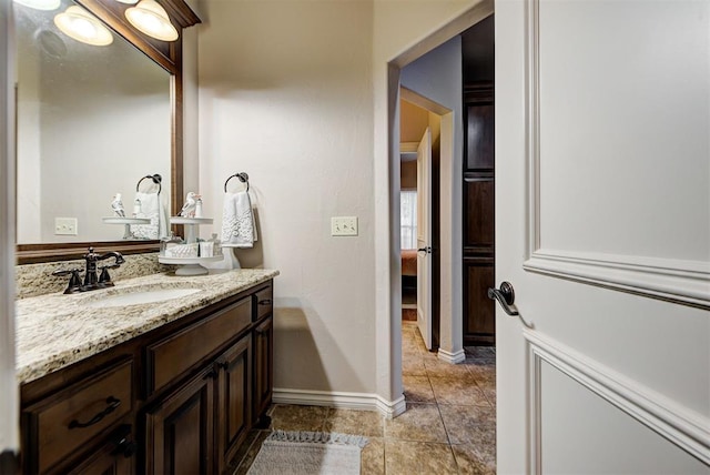 bathroom with tile patterned flooring and vanity