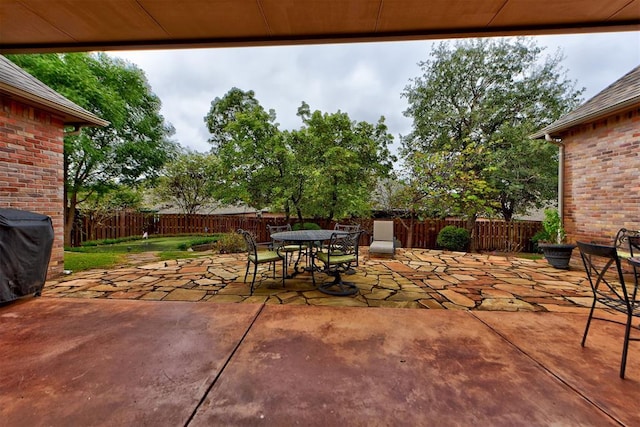 view of patio / terrace featuring outdoor dining space and a fenced backyard