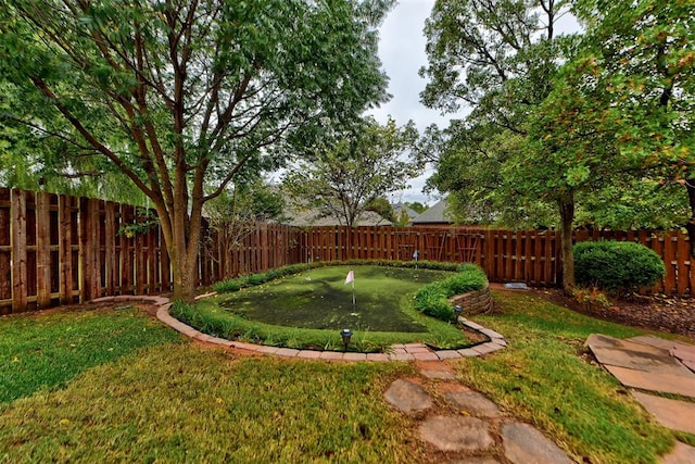 view of yard with a fenced backyard