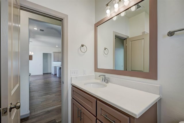 bathroom featuring wood-type flooring and vanity