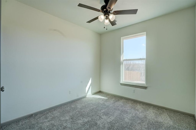 spare room with light carpet and ceiling fan