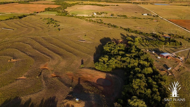 birds eye view of property with a rural view