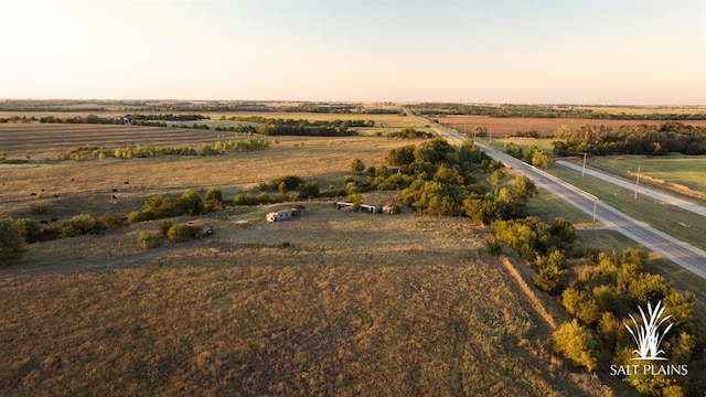 aerial view at dusk featuring a rural view