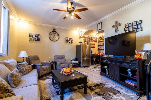 tiled living room with crown molding and ceiling fan