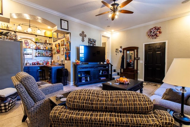 living room featuring bar area, ceiling fan, light tile patterned floors, and ornamental molding