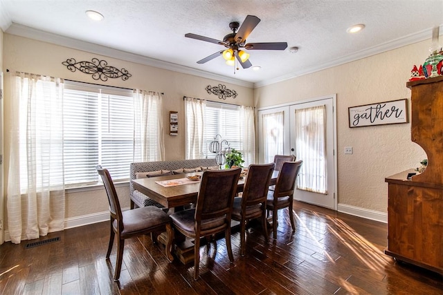 dining area with ceiling fan, dark hardwood / wood-style flooring, and ornamental molding