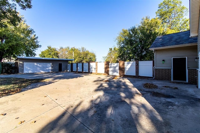 view of front facade featuring a garage and an outdoor structure