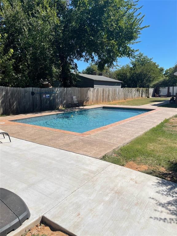 view of swimming pool with a patio area