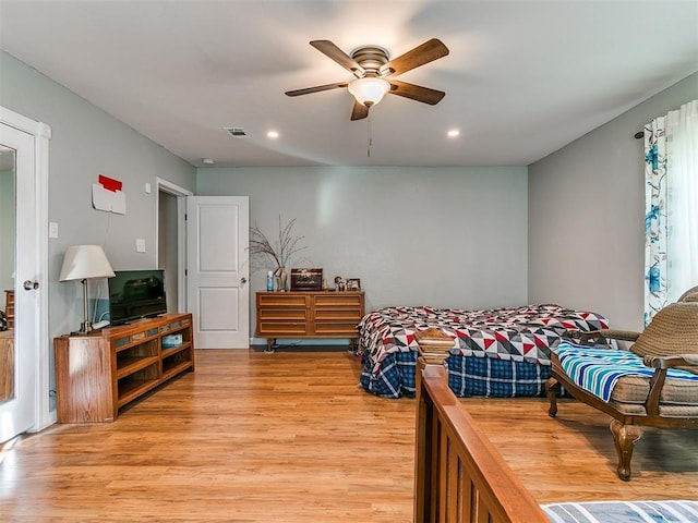 bedroom featuring ceiling fan and light hardwood / wood-style flooring