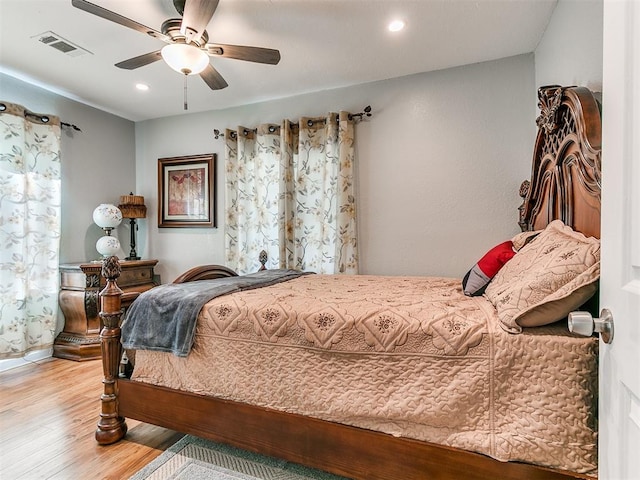 bedroom featuring light wood-type flooring and ceiling fan