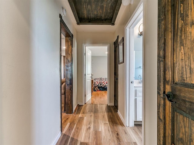 hall with light hardwood / wood-style flooring