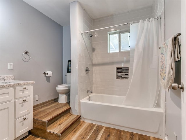 full bathroom featuring shower / bath combination with curtain, vanity, wood-type flooring, and toilet