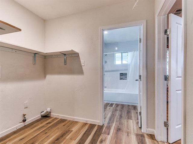 laundry area featuring hardwood / wood-style flooring