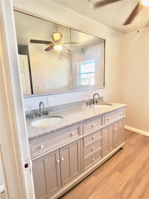 bathroom featuring vanity, hardwood / wood-style flooring, and ceiling fan